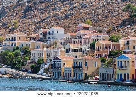 Seascape With Panoramic View Of The Traditional Colorful Houses And The Port Called Yalos With The S