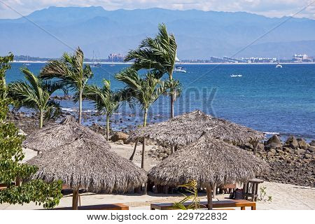 Pacific Ocean Background With Thatched Palm Palapas, Huanacaxtle, Jalisco, Mexico