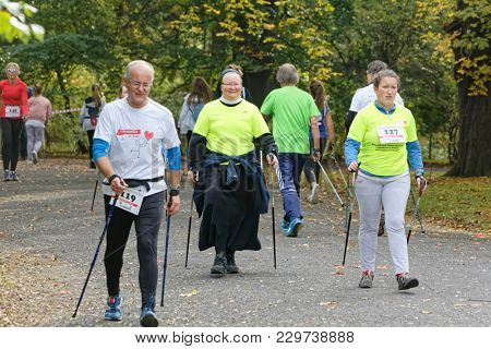 WROCLAW, POLAND - OCTOBER 15, 2017: People in fitness course nordic walking competition in the city park