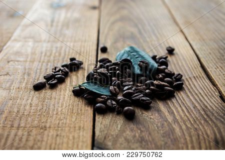 Coffe Beans And Green Leaf