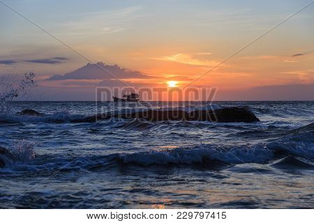 Boat Floating In The Sea For Fishing In The Sunset
