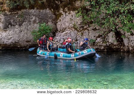 Adventure Team Doing Rafting On The Cold Waters Of The Voidomatis River In Zagori. Voidomatis River
