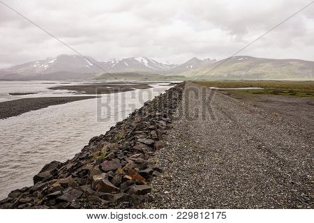 Gravel Road Near The River And Ocean In Stafafell Area In Iceland