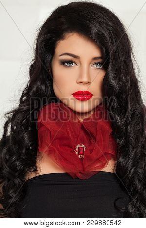 Beautiful Brunette Woman With Golden Brooch And Red Lips