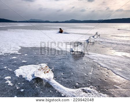 Shining Shards Of Broken Ice. Abstract Still Life Of Ice Floes On Lavel Of Frozen Lake.