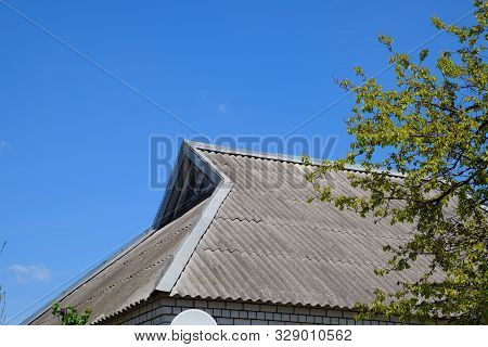 The Roof Of The House Is Made Of Slate. Old Slate On The Roof