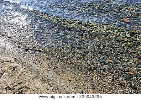 Clean Water In Lake Turgoyak On The Beach In Autumn, The Lake Is Also Called The Younger Brother Of 