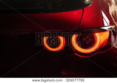 Close Up Car Tail Light Red Color On Service Blurry Background.using Wallpaper Background For Automo
