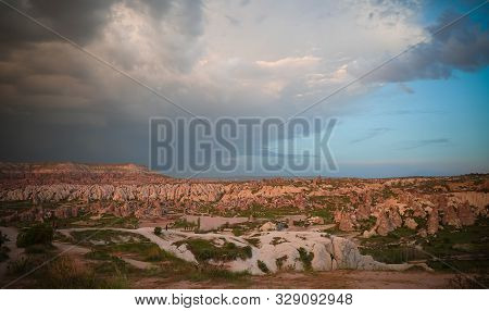 Sunset Panoramic View To Goreme City And Red, Rose And Meskendir Valleys Cappadocia, Turkey