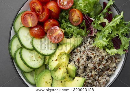 Close Up Of Budha Bowl With Quinoa, Avocado, Cucumber, Salad, Tomatoe, Olive Oil Clean Eating Diet F