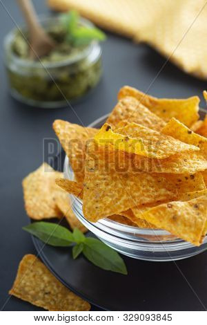 Nachos Chips Or Corn Mexican Chips In Glass Bowl, Isolated Healthy Food Snack Dark Background