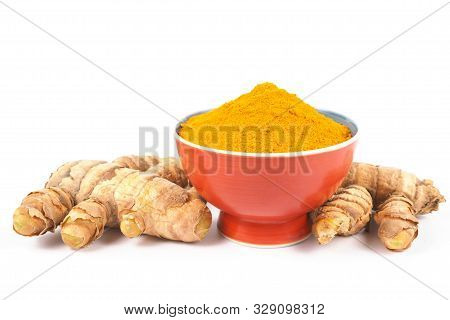 Turmeric Powder (curcuma) In Brown Bowl On White Background. Herbal