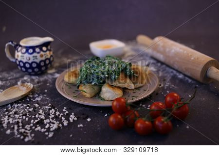 Dumplings With Spinach. Fried Home-made Dumplings With Stuffing. Composition Of Dishes On A Dark Bac