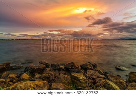 Landscape Small Lake With Sunset With Stone At Foreground