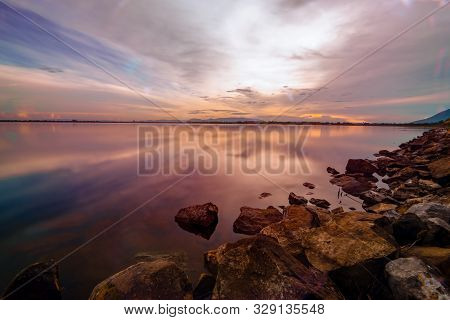 land scape sunset at dam in Thailand with full color