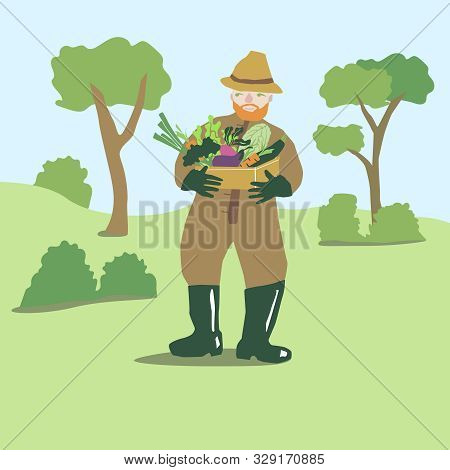 Heerful Farmer With A Box With Vegetables In His Hands.