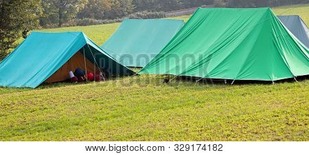 Big Canadian Tents On The Camp Site Of Boyscout In Early Morning
