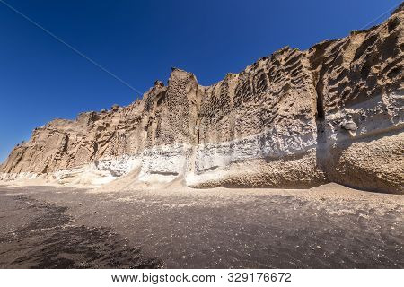 Canyon Mountains On Vlychada Beach On A Sunny Summer Day.