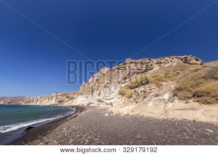 Canyon Mountains And Sea With Black Volcanic Beach On Vlychada.