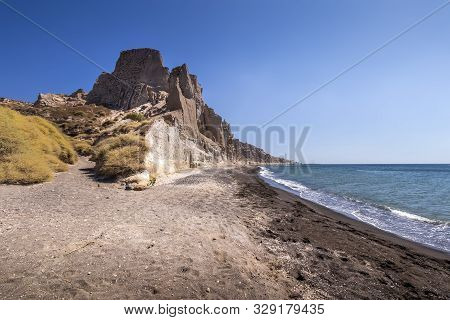 Canyon Mountains And Sea With Black Volcanic Beach On Vlychada.