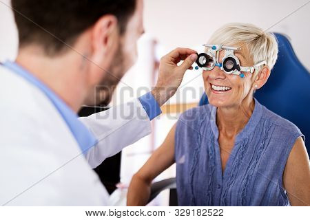 Senior Woman Taking An Eyesight Test Examination At An Optician Clinic