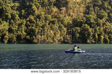 A Couple Enjoying A Romantic Boat Ride In Pregnant Maiden Island, Langkawi, Malaysia