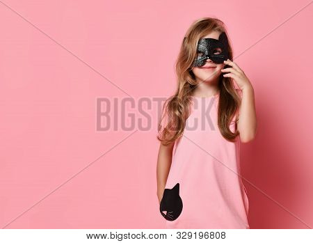 Christmas And New Year Concept. Smiling Kid Girl Blonde With Long Wavy Hair In Cat Mask And Cute Pin