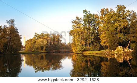 Beautiful View Of The Park In Lednice On The Lake, Bridge And Minaret In Autumn