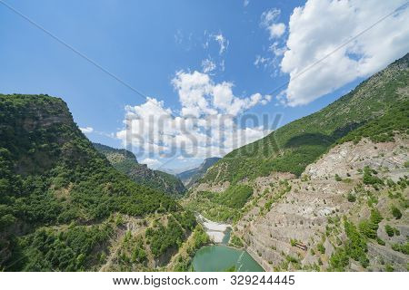 Deep Terraced Sides Of Gorge Through Mountains Of Greece.