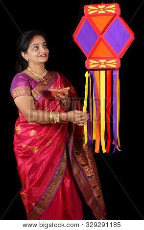An Indian Woman Holding A Traditional Diwali Lamp Adoring Her Diwali Lantern Also Called As Sky Lant