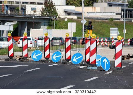 Row Of Warning And Directional Road Signs Marking Start Of Road Reconstruction And Redirecting Traff