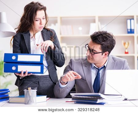 The businessman asking for paperwork from his assistant secretar