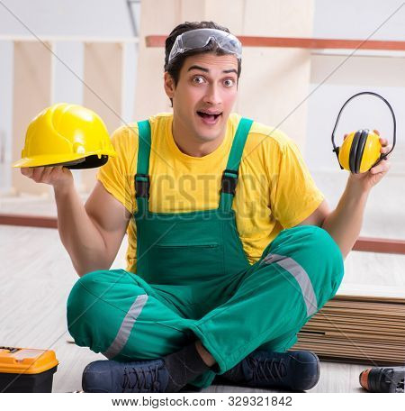 Worker showing the importnace of wearing noise cancelling headph