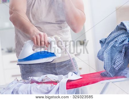 Inattentive husband burning clothing while ironing