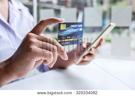 Business Woman Using Smartphone, Laptop And Holding Credit Card For Paying Detail Page Display Onlin