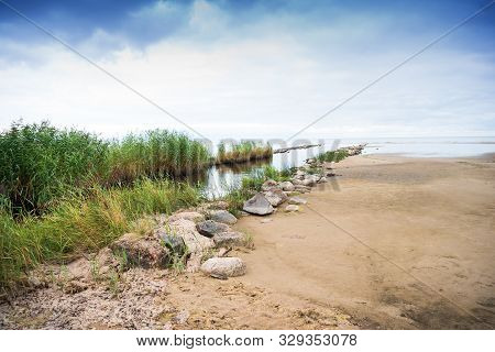 Rocky And Sandy Seashore Landscape