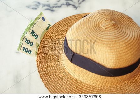 Sun Hat With 100 Hundredth Euro Banknotes. Money Or Vacation Concept