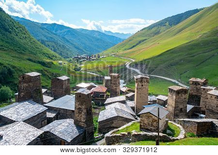 View Of The Ushguli Village At The Foot Of Mt. Shkhara. Picturesque And Gorgeous Scene. Rock Towers