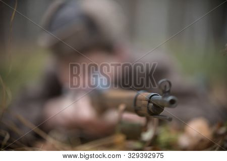 A Picture Of Rifle In The Soldiers Hand