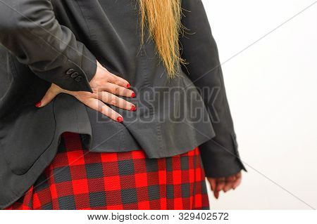 Close-up View Of Office Worker Woman With Pain In Kidneys Isolated On A White Background. Woman With