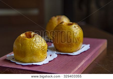 Baked Apples Antonovka On A Blurred Background.