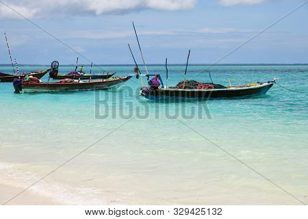 Fishing Boats Moored In The Indian Ocean Near Beach, Zanzibar, Tanzania, Africa