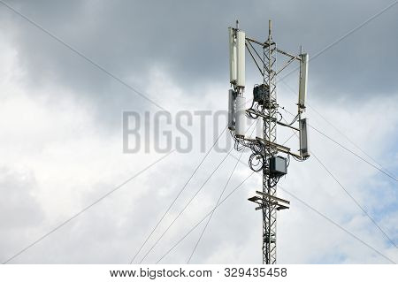 Communication Cellular Signal Tower. 3g, 4g, 5g Phone Signal Base Station. Urban Antenna Repeater To