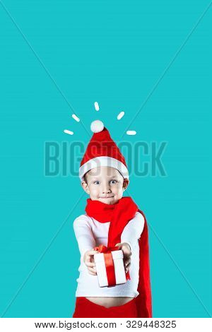 Little Cheerful Santa Gives A Gift On A Mint Background