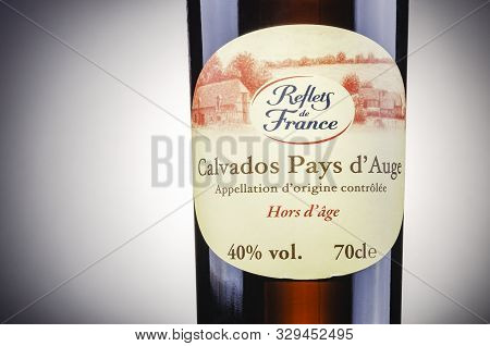 Bottle Of Calvados On Gradient Background. Calvados Is Kind Of Apple Brandy Manufactured In Normandy