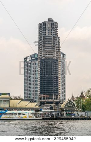 Bangkok City, Thailand - March 17, 2019: Chao Phraya River. Tall Skyscraper Under Construction With 