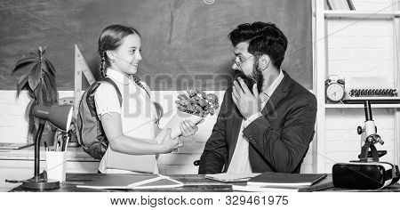 Back To School. Happy Teachers Day. Small School Girl Kid With Flower Bouquet. Flower Present For Be