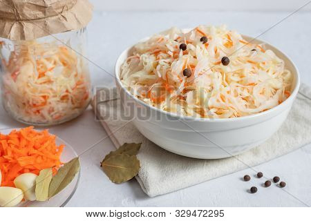 Homemade Sauerkraut. Fermented Food. Sauerkraut With Carrots In A White Bowl On A White Background C
