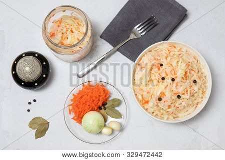 Homemade Sauerkraut. Fermented Food. Sauerkraut With Carrots In A Bowl With A Fork And A Glass Jar O