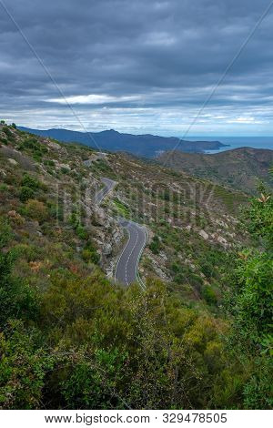 View On Amazing Mountain Road In Catalunya, Spain. Serpentine Mountain Route In Spain On Cloudy Sky 